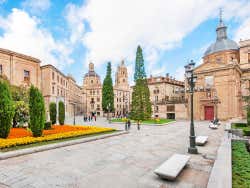 Streets in Salamanca under a blue and cloudy sky