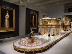 Portraits on the walls and models in the centre of the room